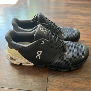 On Running Black and White Athletic Shoes with Mesh Upper